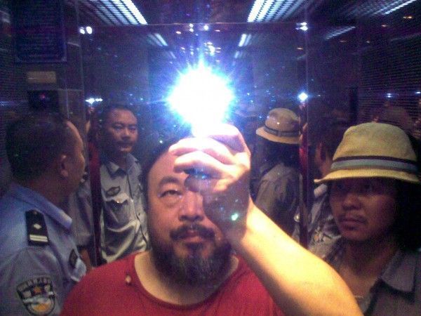 Ai-Weiwei_Ai-Weiwei-with-rockstar-Zuoxiao-Zuzhou-in-the-elevator-when-taken-in-custody-by-the-police-Sichuan-China-August-2009-600x450