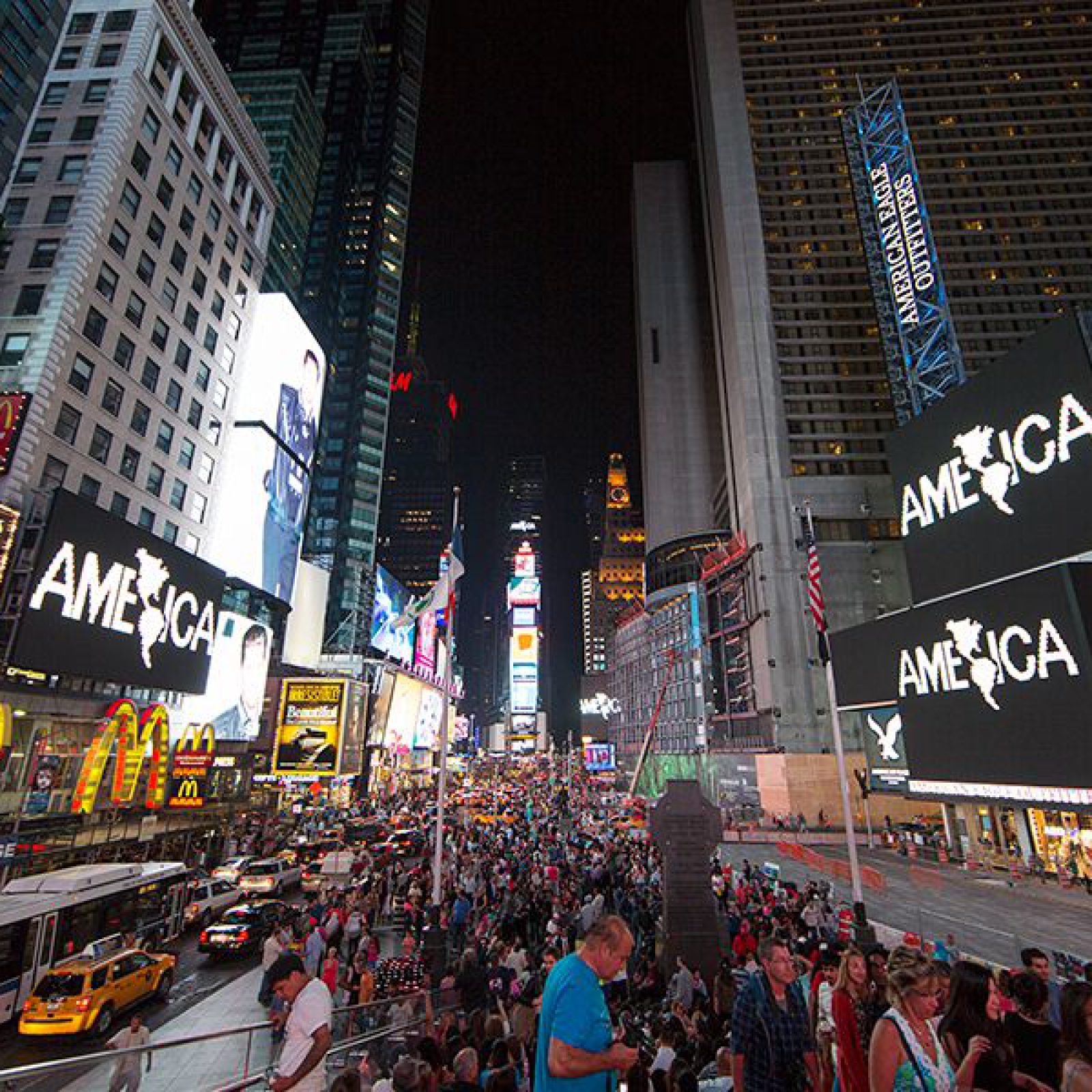 Midnight Moment: Alfredo Jaar, A Logo for America, August 1-31, 2014; 11:57-midnight, every night. Photograph by Ka-Man Tse for @TSqArts. Midnight Moment is a presentation of the Times Square Advertising Coalition (TSAC) and Times Square Arts. This month in in collaboration with the Solomon R. Guggenheim Museum. Midnight Moment: A Digital Gallery is the largest coordinated effort in history by the sign operators in Times Square to display synchronized, cutting-edge creative content at the same time every day.