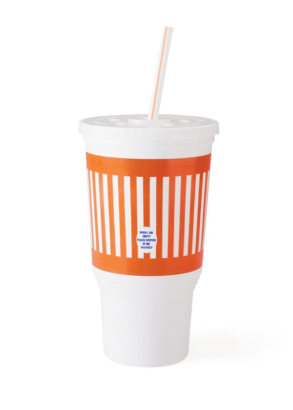 A fast-food drink cup with orange and white stripes against a white background